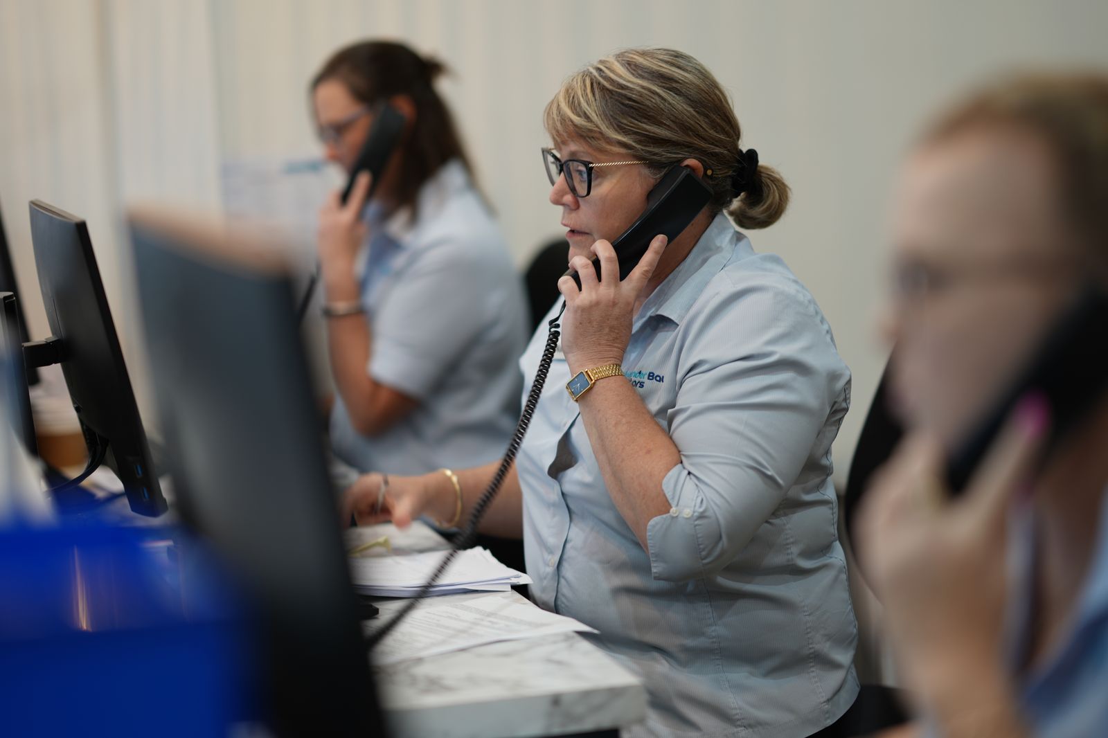 The reception team taking calls at Salamander Bay Doctors